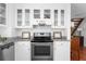 Well-equipped kitchen showcases white cabinetry, stainless steel appliances, and granite countertops at 1514 Village Sq, Mount Pleasant, SC 29464