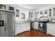Well-equipped kitchen featuring stainless steel appliances, white cabinets, and stone countertops at 1514 Village Sq, Mount Pleasant, SC 29464