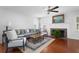 Cozy living room featuring a fireplace, hardwood floors, and stylish furnishings at 1514 Village Sq, Mount Pleasant, SC 29464