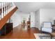 Inviting living room and staircase with wood floors and lots of natural light at 1514 Village Sq, Mount Pleasant, SC 29464