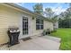 Rear view with a door to the backyard, a grill and plants for outdoor relaxation and entertaining at 1583 Southwick Dr, Johns Island, SC 29455