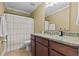 Bathroom with granite countertop vanity and shower with white patterned curtain at 1583 Southwick Dr, Johns Island, SC 29455