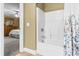 Ensuite bathroom includes a shower/tub combo with tile flooring, accessible from bedroom at 1583 Southwick Dr, Johns Island, SC 29455