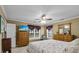 Bedroom with a floral bedspread, dresser, and a TV with beautiful natural light at 1583 Southwick Dr, Johns Island, SC 29455