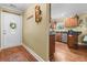 Warm entryway with a decorated front door leading to the kitchen at 1583 Southwick Dr, Johns Island, SC 29455