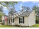 Bright, welcoming home featuring classic vinyl siding and black shutters at 1583 Southwick Dr, Johns Island, SC 29455
