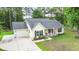 Charming single-story home with a two-car garage, manicured lawn, and a welcoming front porch at 1583 Southwick Dr, Johns Island, SC 29455