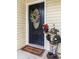 Welcoming front door with charming decorations and a cozy ambiance at 1583 Southwick Dr, Johns Island, SC 29455