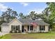 Charming one-story home with a manicured lawn and cozy front porch at 1583 Southwick Dr, Johns Island, SC 29455
