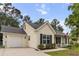 Inviting single-story home with vinyl siding, black shutters, and an attached garage at 1583 Southwick Dr, Johns Island, SC 29455