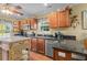 Charming kitchen featuring wooden cabinets, stainless steel appliances, and stylish decor at 1583 Southwick Dr, Johns Island, SC 29455