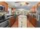 Inviting kitchen with dark countertops, wooden cabinetry, and ample counter space at 1583 Southwick Dr, Johns Island, SC 29455