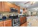 Spacious kitchen with stainless steel appliances, wooden cabinets, and granite countertops at 1583 Southwick Dr, Johns Island, SC 29455