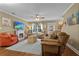 Comfortable living room with ceiling fan, fireplace, and several seating options at 1583 Southwick Dr, Johns Island, SC 29455