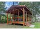 Charming wood pavilion surrounded by lush greenery, creating a tranquil outdoor space for relaxation at 1583 Southwick Dr, Johns Island, SC 29455
