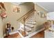 Staircase with wood railing and treads, with white risers at 1583 Southwick Dr, Johns Island, SC 29455
