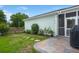 Backyard includes a stone paver path leading to a screened patio, and a neatly maintained lawn and garden at 1870 Gammon St, Charleston, SC 29414