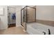 Modern bathroom features separate shower and soaking tub, plus a walk-in closet at 1870 Gammon St, Charleston, SC 29414