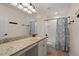 Well-lit bathroom features a single sink vanity and a shower-tub combo at 1870 Gammon St, Charleston, SC 29414
