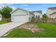 The property showcases a detached garage, fenced yard, and light-colored siding, with a charming curb appeal at 1870 Gammon St, Charleston, SC 29414