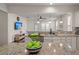 Open-concept kitchen featuring granite countertops, stainless steel sink, and a view to the living room at 1870 Gammon St, Charleston, SC 29414