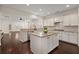 Open-concept kitchen with white cabinets, granite countertops, stainless steel appliances, and a central island at 1870 Gammon St, Charleston, SC 29414