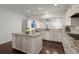 Modern kitchen featuring a central island, granite countertops, stainless steel appliances, and hardwood floors at 1870 Gammon St, Charleston, SC 29414