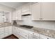 Updated kitchen featuring granite countertops, gas range, white cabinetry, and subway tile backsplash at 1870 Gammon St, Charleston, SC 29414