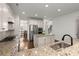 Modern kitchen with stainless steel appliances, granite countertops, and white cabinetry with an island at 1870 Gammon St, Charleston, SC 29414