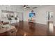 Comfortable living room showcasing hardwood floors, ceiling fan, and an open layout with ample natural light at 1870 Gammon St, Charleston, SC 29414