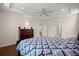 Well-lit main bedroom offers tray ceiling, hardwood floors, and multiple access doors at 1870 Gammon St, Charleston, SC 29414