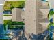 Overhead view of a residence showing the roof, driveway, and surrounding greenery at 1876 Towne St, Johns Island, SC 29455