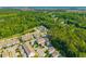 Aerial view of a neighborhood with tree-lined streets and manicured lawns at 1876 Towne St, Johns Island, SC 29455
