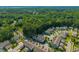 Stunning aerial shot of a residential area nestled amongst a dense forest at 1876 Towne St, Johns Island, SC 29455
