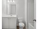 A well-lit bathroom featuring a vanity, toilet, and bathtub with shower at 1876 Towne St, Johns Island, SC 29455