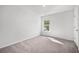 The bedroom has neutral carpet, one window, and a closet at 1876 Towne St, Johns Island, SC 29455