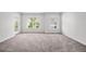Sunlit bedroom featuring plush carpeting, offering comfort and relaxation at 1876 Towne St, Johns Island, SC 29455