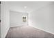 A cozy bedroom with neutral carpet, a window, and white trim at 1876 Towne St, Johns Island, SC 29455