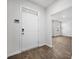 Inviting entryway with wood-look flooring, white walls, and a front door at 1876 Towne St, Johns Island, SC 29455