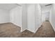 Bright hallway with hard surface flooring and crisp, white walls at 1876 Towne St, Johns Island, SC 29455