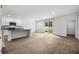 Open-concept kitchen with a breakfast bar, white cabinets, and stainless microwave at 1876 Towne St, Johns Island, SC 29455
