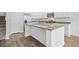 Stylish kitchen island with granite countertops, sink, and ample storage space at 1876 Towne St, Johns Island, SC 29455