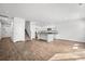 Open-concept living space with a kitchen, an island, hard surface floors, and staircase at 1876 Towne St, Johns Island, SC 29455