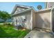 Outdoor wall with utility connections, complemented by green grass and a side yard patio at 1876 Towne St, Johns Island, SC 29455
