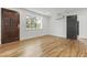 Bright bedroom featuring hardwood floors, fresh white walls, and natural light coming in through large windows at 19 Smith St # D, Charleston, SC 29401