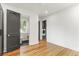 Bright bedroom with ensuite bathroom, modern washer/dryer closet, and hardwood floors at 19 Smith St # D, Charleston, SC 29401