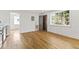 Bright living room featuring hardwood floors, fresh white walls, and natural light coming in through large windows at 19 Smith St # D, Charleston, SC 29401