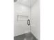 Bathroom shower featuring glass door, tile walls, modern drain and built in shelf at 19 Smith St # D, Charleston, SC 29401