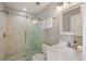 A clean and bright bathroom features glass shower doors and neutral walls and fixtures at 2 Francis St # I, Charleston, SC 29403