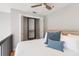 Bedroom with neutral walls and a ceiling fan and a closet with bifold doors at 2 Francis St # I, Charleston, SC 29403